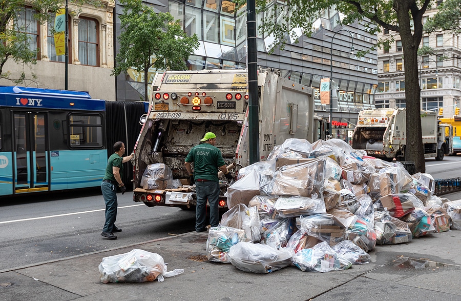 NYC Garbage Haulers Collectin Trash from curbside.