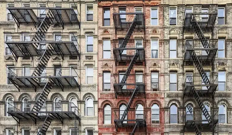 Row of NYC tenements to illustrated post on clearing DOB violations